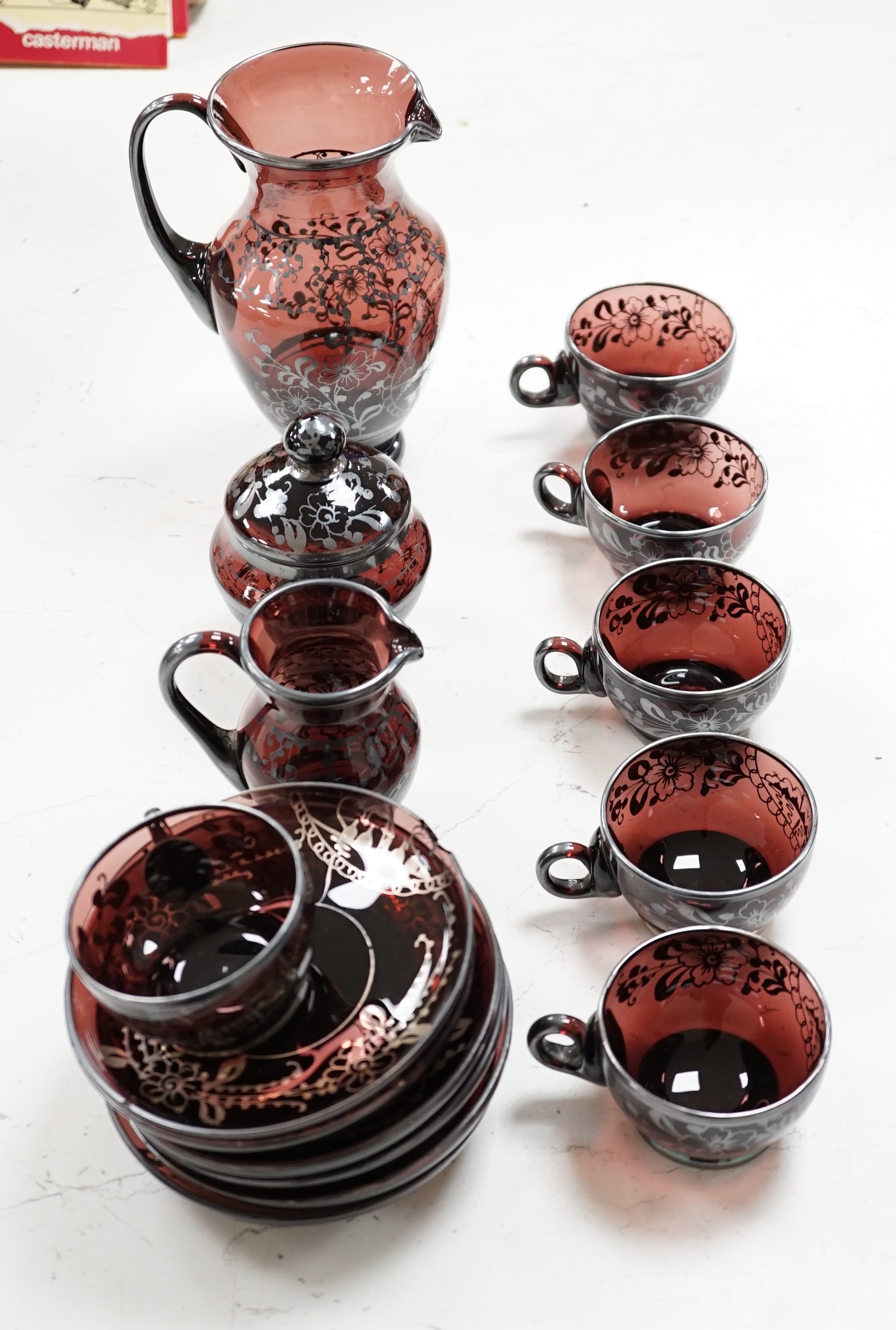 A Venetian amethyst glass tea set. Condition - some damage